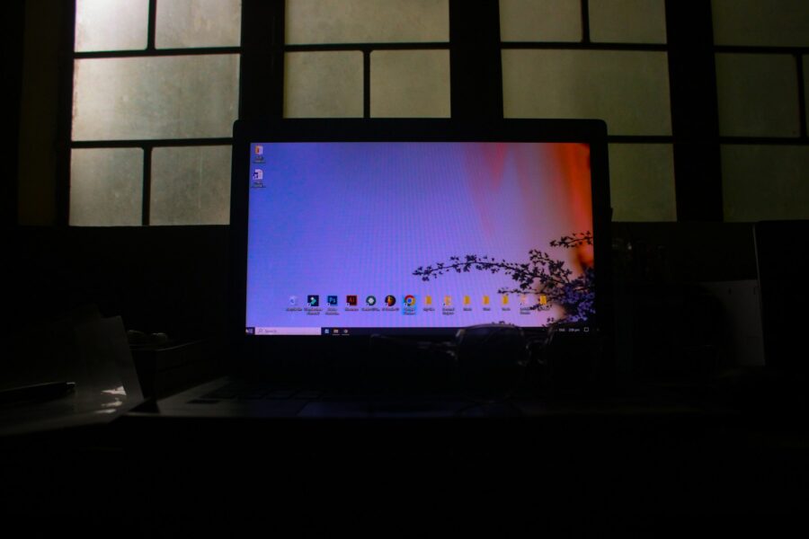 Laptop login screen dark room security alert