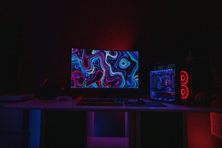 Person gaming desk monitor soft lighting
