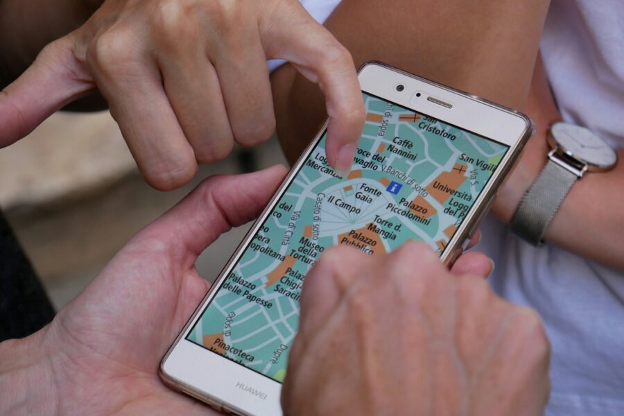 Laptop map smartphone travel app