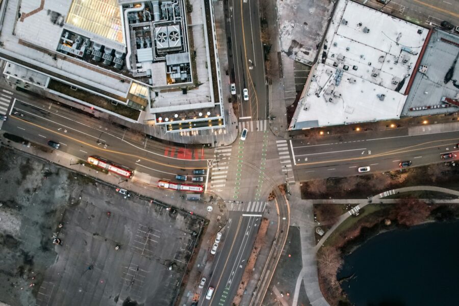 City intersection traffic lights aerial cars buses