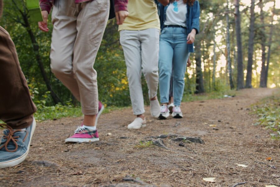 Family wearing fitness trackers walking outdoors