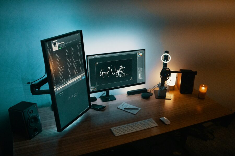 Indie game developer desk dual monitors code artwork