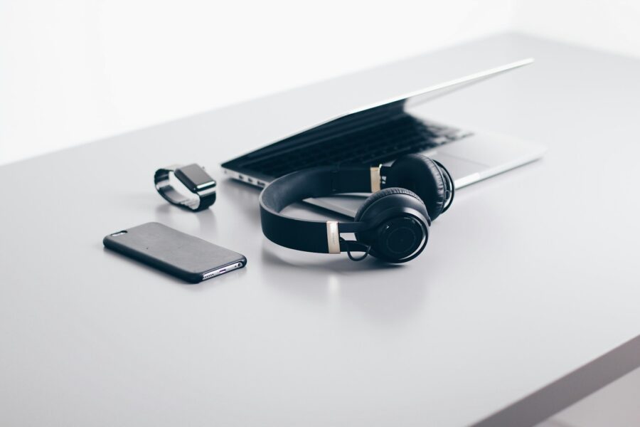 Smartphone podcast app headphones desk