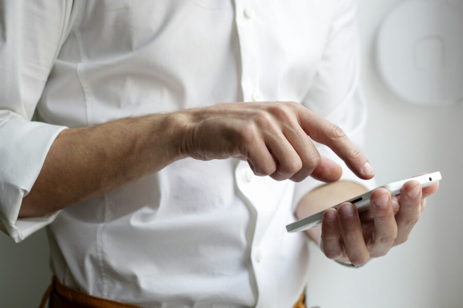 Smartphone browsing screen closeup hand