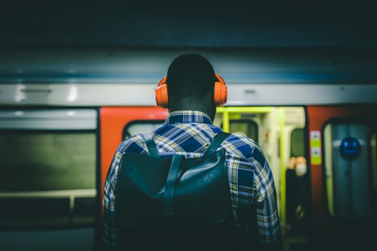 Person using wireless earbuds train