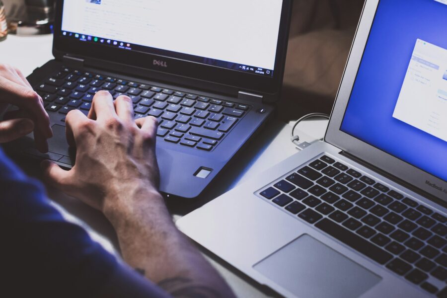 Person downloading software laptop security warning