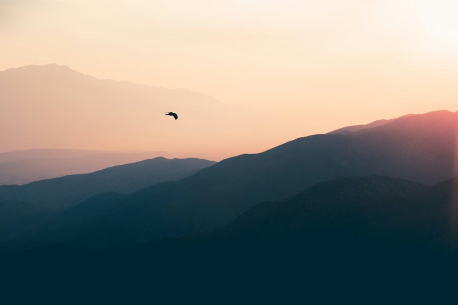 Drone flying over landscape mountains sunset