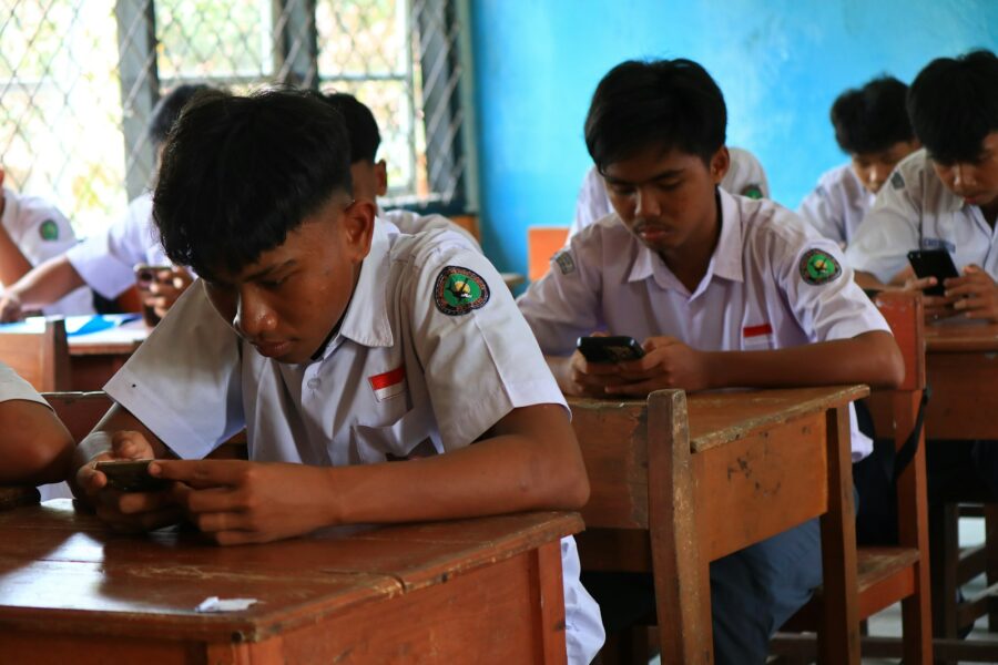 Smartphone language learning app student desk