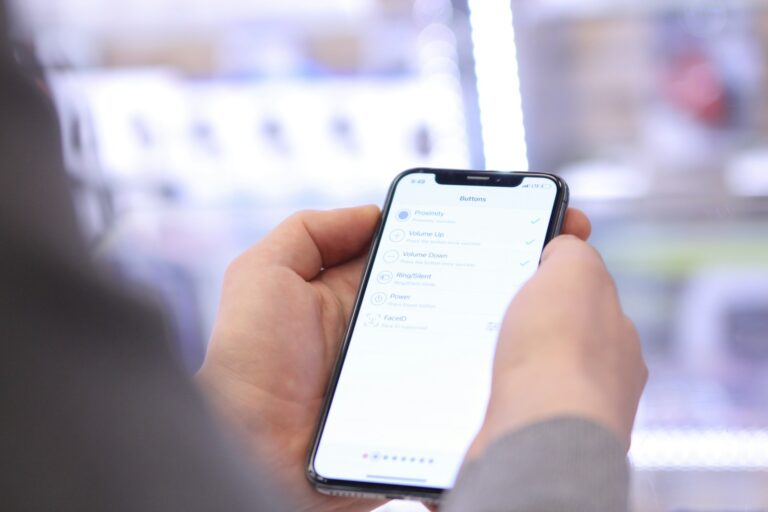 Smartphone settings battery screen person comparing phones store