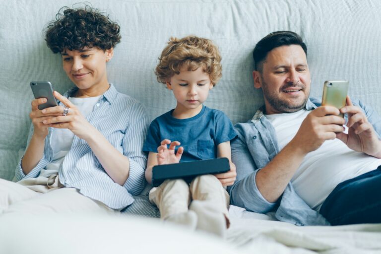Close console controller child hands family using tablet