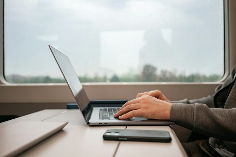 Office worker using translation app laptop traveler using