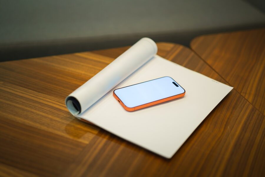 Mid range smartphone wooden desk