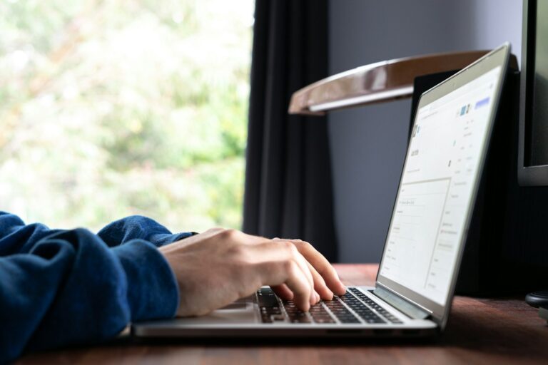 Onedrive file status icons screenshot person using laptop