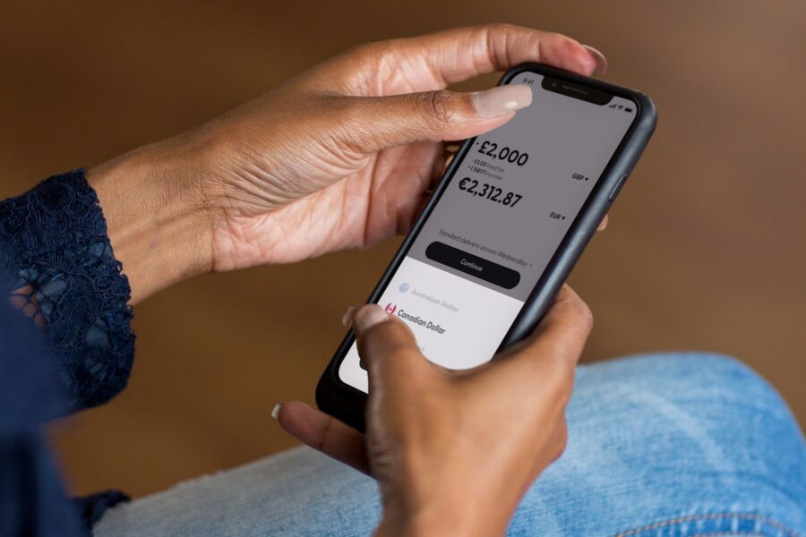 Person using banking app smartphone indoors