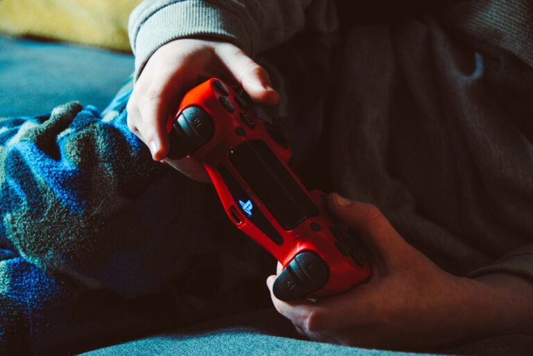 Hands holding gamepad couch