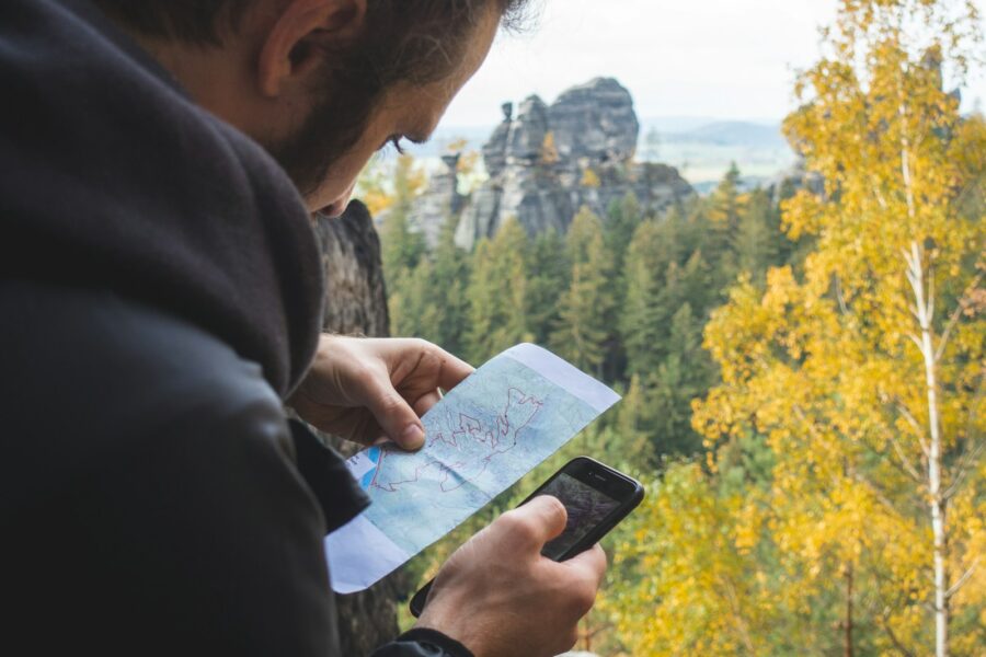 Traveler using smartphone city map