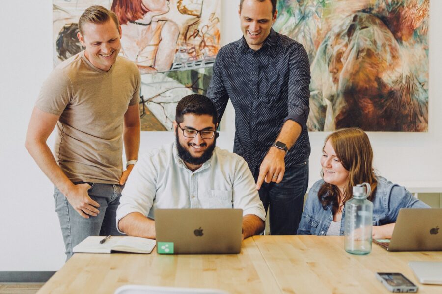 Office workspace laptop coding team