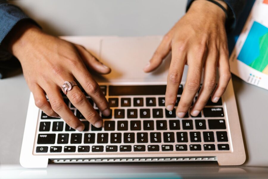 Hands laptop keyboard