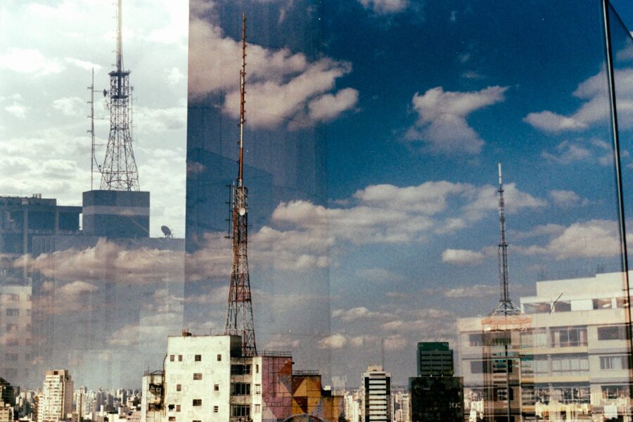 Cell tower antennas city skyline