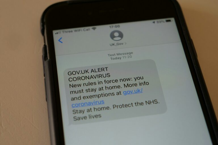 Parcel delivery scam text message smartphone