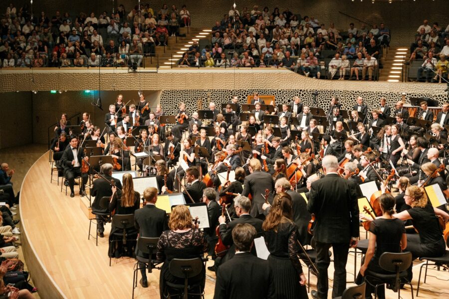 Orchestra stage lights audience concert hall