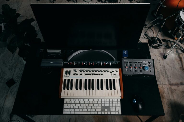 Headphones keyboard desk monitor vinyl record player album