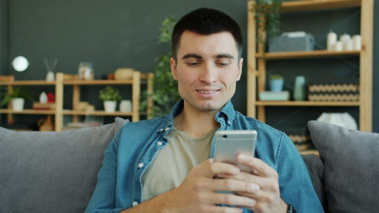 Smartphone meditation app calm person sofa
