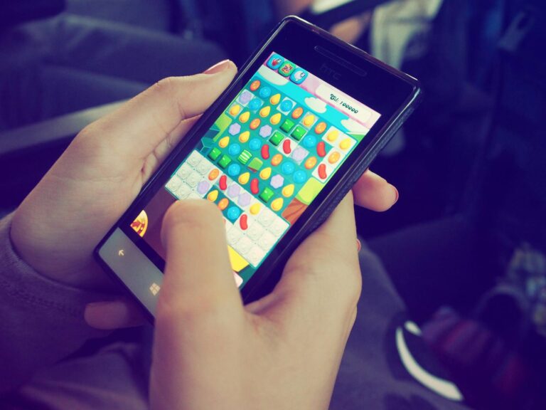 Smartphone rhythm game interface hands tapping