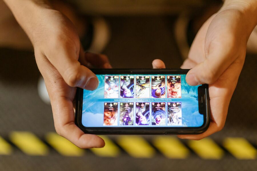 Smartphone rhythm game interface hands tapping