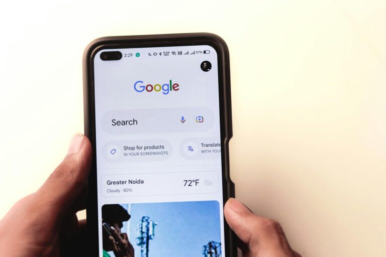 Smartphone hand google photos app screen