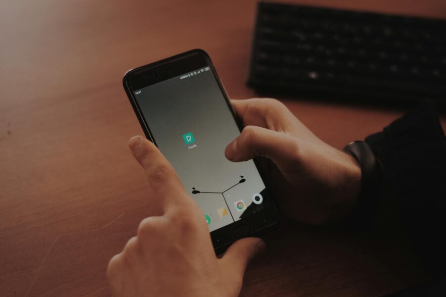Hand tapping smartphone