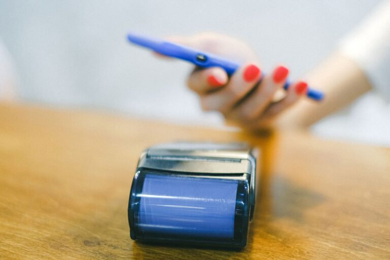 Hand tapping smartphone