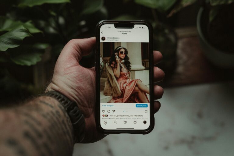 Smartphone hand holding chat app person viewing stories