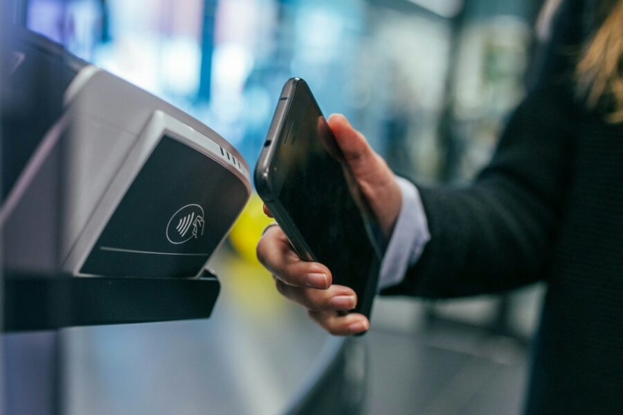 Person paying smartphone