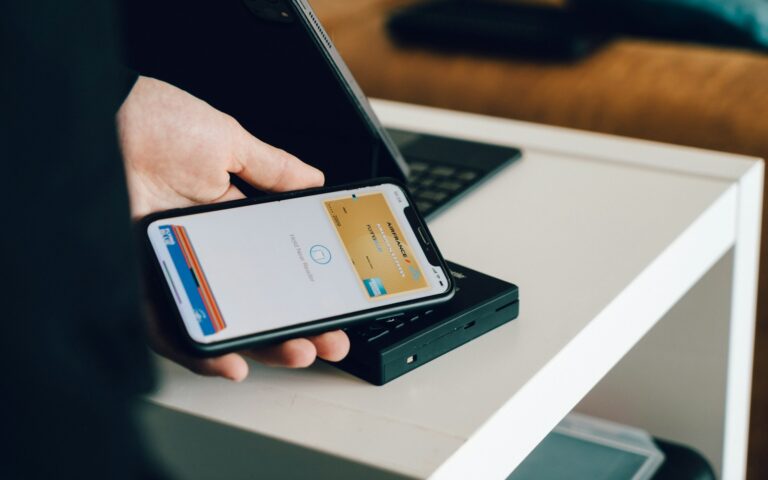 Person paying smartphone