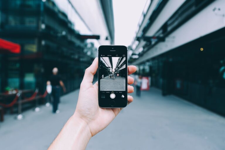 Person taking smartphone